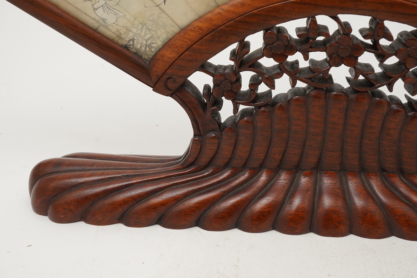 A Chinese painted paper fan leaf, 19th century, with hongmu frame and stand, early 20th century